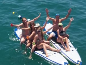 Paddle boarding Sitting